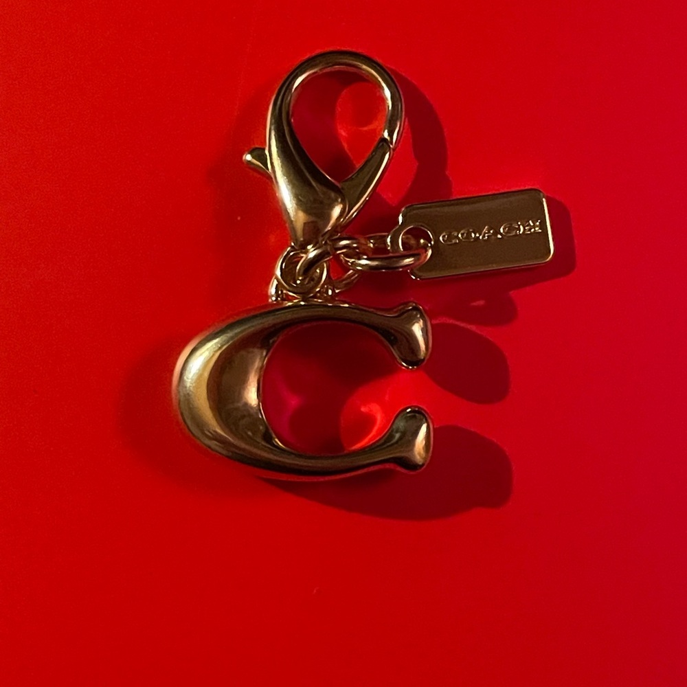 NWOT Gold Coach C Charm